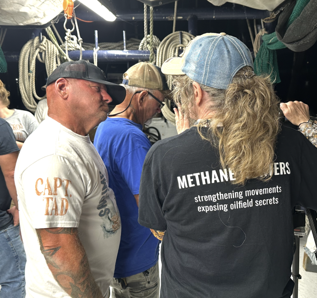 Image: Sharon on Captain Tad’s shrimp boat talking to him about methane emissions from the Venture Global LNG export facility that has decimated the local shrimp fishing industry.